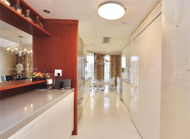 reception area featuring an inviting chandelier