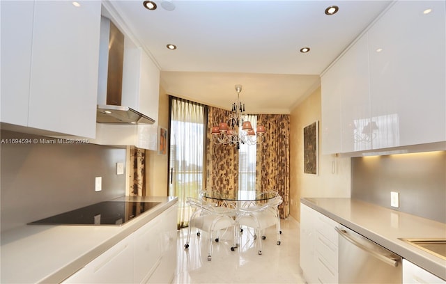 kitchen with white cabinetry, hanging light fixtures, stainless steel dishwasher, black electric stovetop, and wall chimney exhaust hood