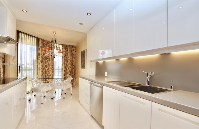 kitchen featuring white cabinetry, sink, decorative light fixtures, and dishwasher