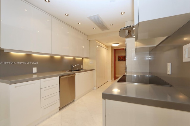 kitchen featuring sink, white cabinetry, light tile patterned floors, stainless steel dishwasher, and black electric stovetop