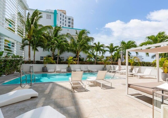 view of swimming pool with a patio