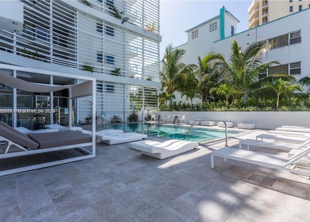 view of pool featuring a patio area