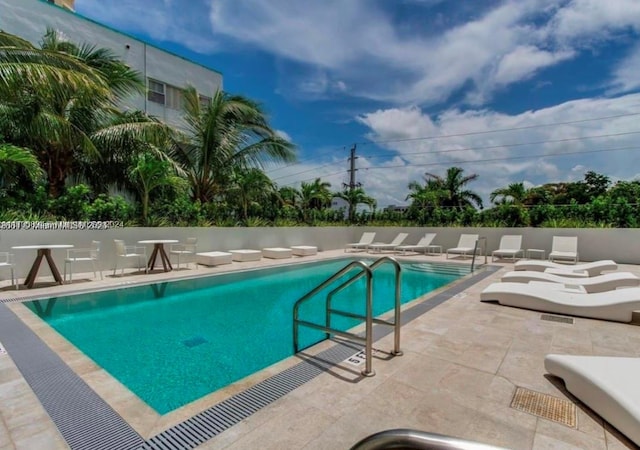 view of swimming pool featuring a patio