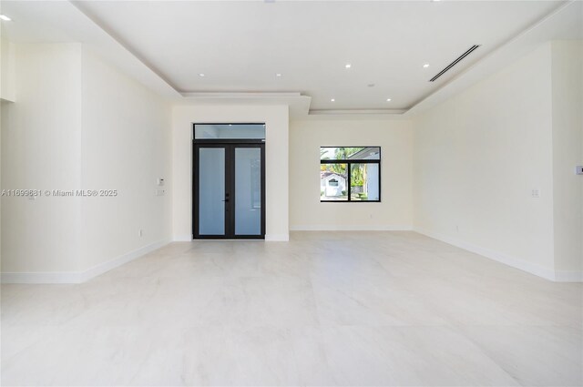 spare room featuring french doors