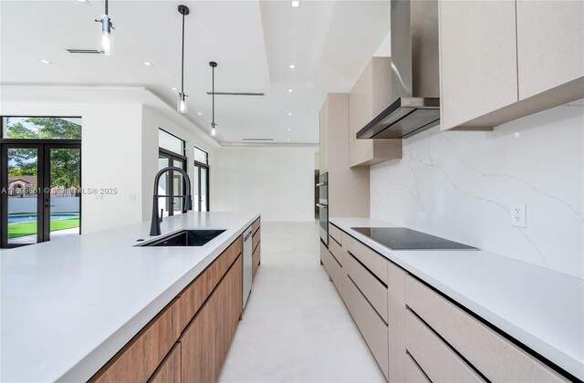 kitchen featuring white cabinetry, sink, wall chimney exhaust hood, hanging light fixtures, and black electric stovetop