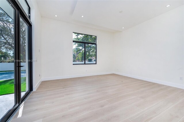 unfurnished room featuring light hardwood / wood-style flooring