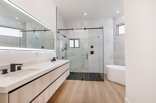 bathroom featuring vanity, an enclosed shower, and toilet