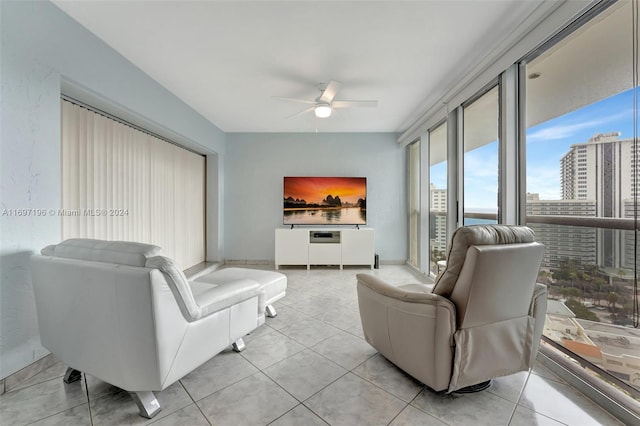 tiled living room featuring ceiling fan