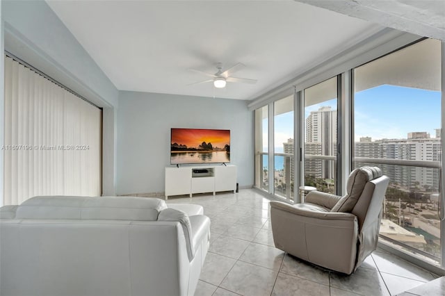 living room with ceiling fan and light tile patterned floors