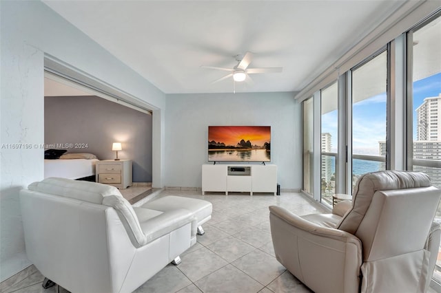 tiled living room with ceiling fan