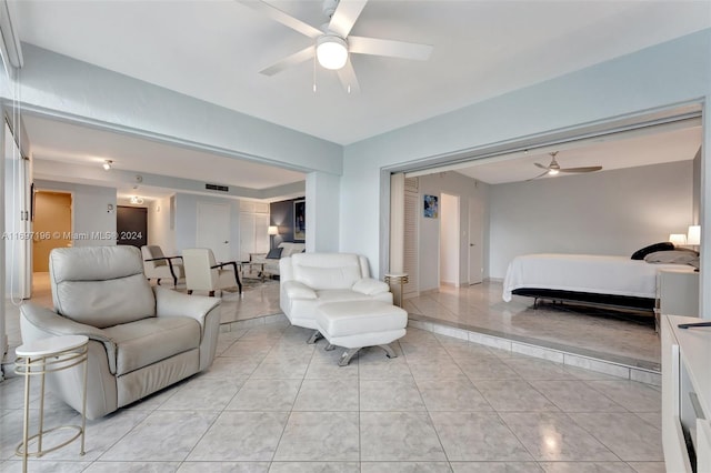 bedroom with ceiling fan and light tile patterned floors