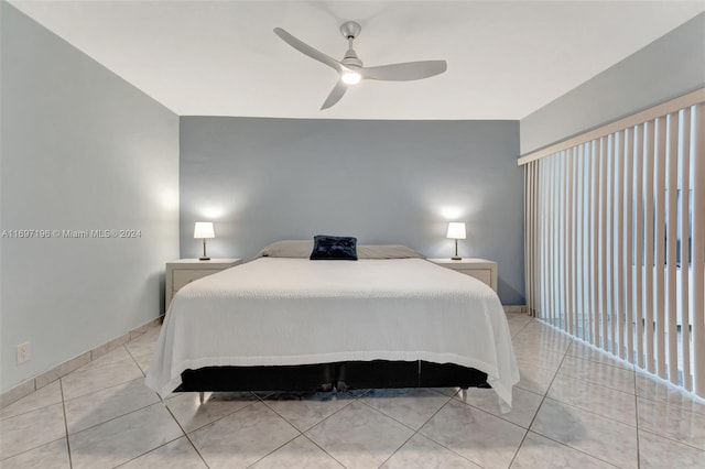 tiled bedroom with ceiling fan