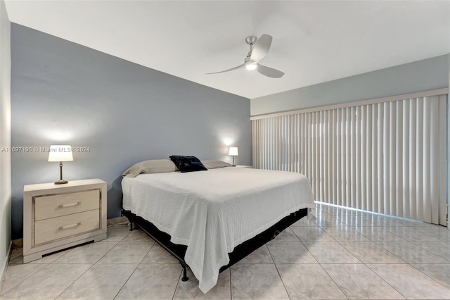 bedroom featuring ceiling fan and light tile patterned floors