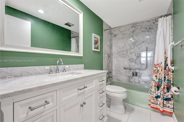 full bathroom featuring tile patterned floors, shower / bath combo with shower curtain, vanity, and toilet