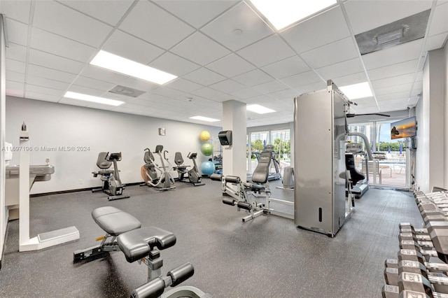 exercise room featuring a paneled ceiling