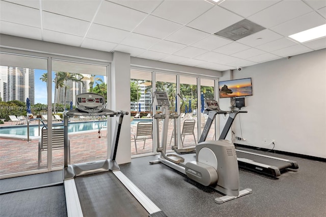 exercise room with a paneled ceiling