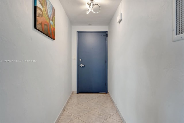 entryway with light tile patterned floors