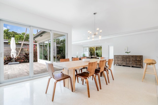 dining space with a chandelier