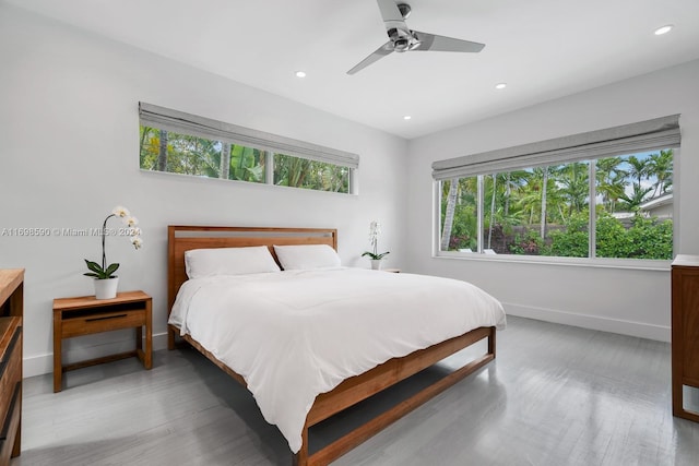 bedroom with wood-type flooring and ceiling fan