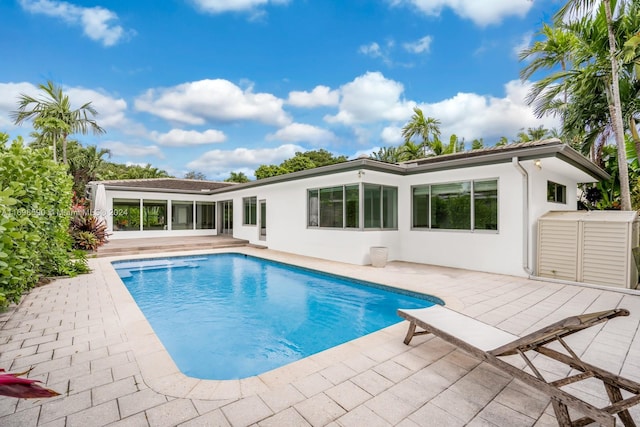 view of swimming pool with a patio