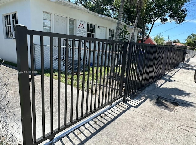 view of gate featuring a fenced front yard