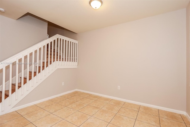 staircase featuring tile patterned floors