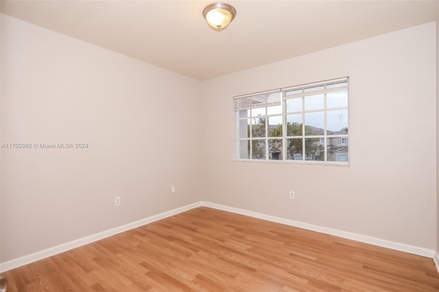 empty room featuring hardwood / wood-style floors