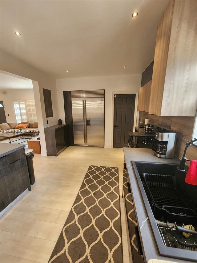 13751 NE 1st Ave, Miami, FL 33161 - kitchen featuring stainless steel built in fridge, recessed lighting, light wood-style flooring, and modern cabinets
