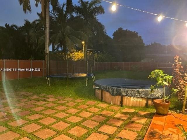 13751 NE 1st Ave, Miami, FL 33161 - fenced backyard with a trampoline