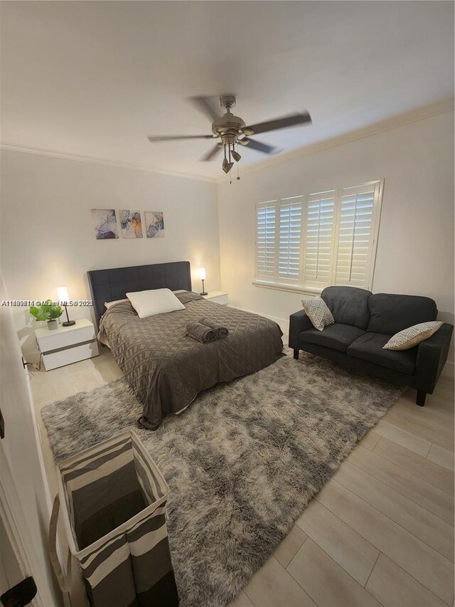 13751 NE 1st Ave, Miami, FL 33161 - bedroom featuring wood finished floors, crown molding, and a ceiling fan