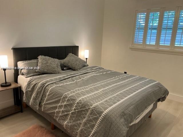 13751 NE 1st Ave, Miami, FL 33161 - bedroom with wood finished floors and baseboards