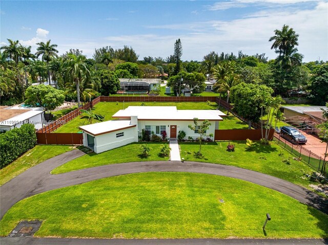 13751 NE 1st Ave, Miami, FL 33161 - view of front of property with asphalt driveway and view of scattered trees