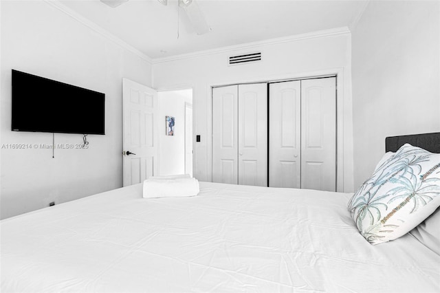 13751 NE 1st Ave, Miami, FL 33161 - bedroom with ornamental molding, a closet, and a ceiling fan