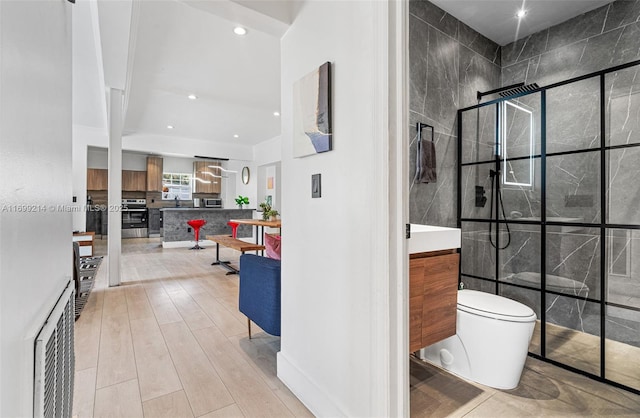 13751 NE 1st Ave, Miami, FL 33161 - full bathroom featuring vanity, tiled shower, wood finished floors, and recessed lighting