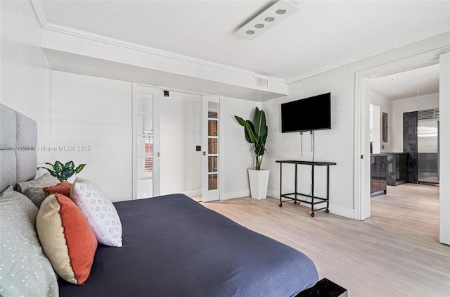 13751 NE 1st Ave, Miami, FL 33161 - bedroom featuring wood finished floors, french doors, and crown molding