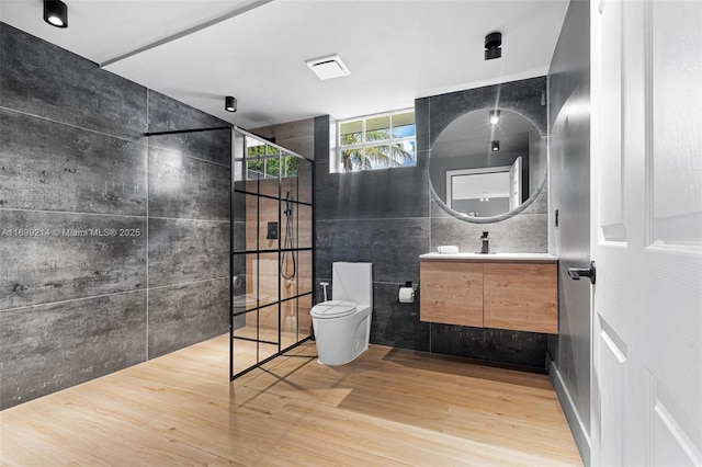 13751 NE 1st Ave, Miami, FL 33161 - full bath featuring wood finished floors, vanity, tile walls, and a tile shower