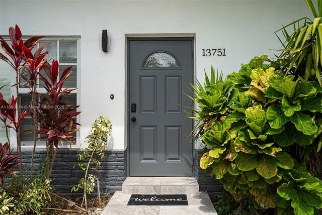 13751 NE 1st Ave, Miami, FL 33161 - doorway to property with stucco siding