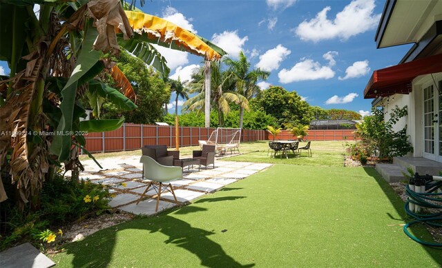 13751 NE 1st Ave, Miami, FL 33161 - fenced backyard featuring a patio area