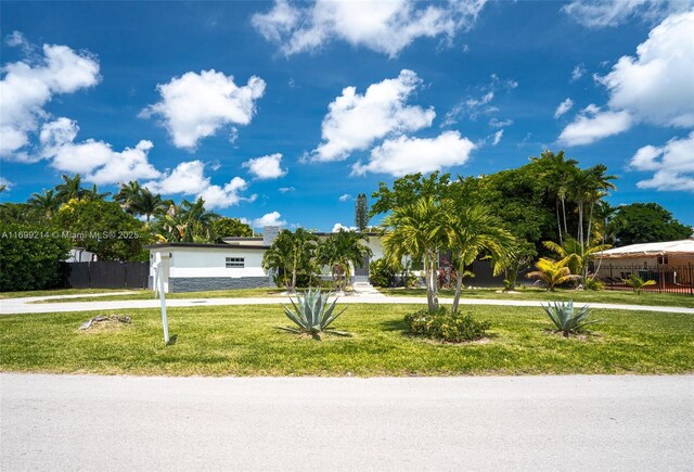 13751 NE 1st Ave, Miami, FL 33161 - obstructed view of property featuring stucco siding