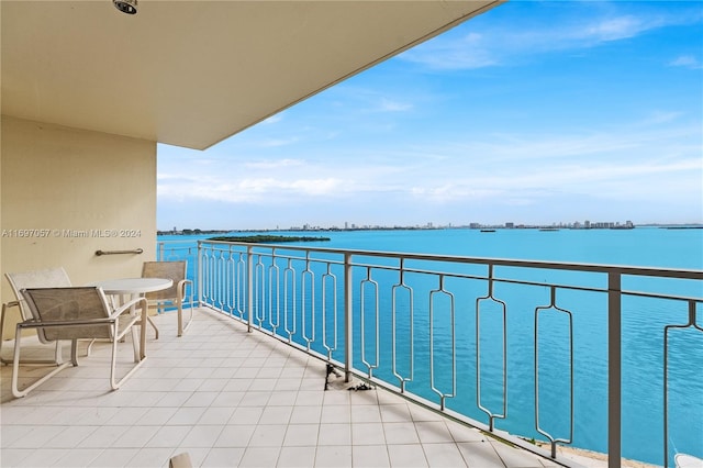 balcony featuring a water view