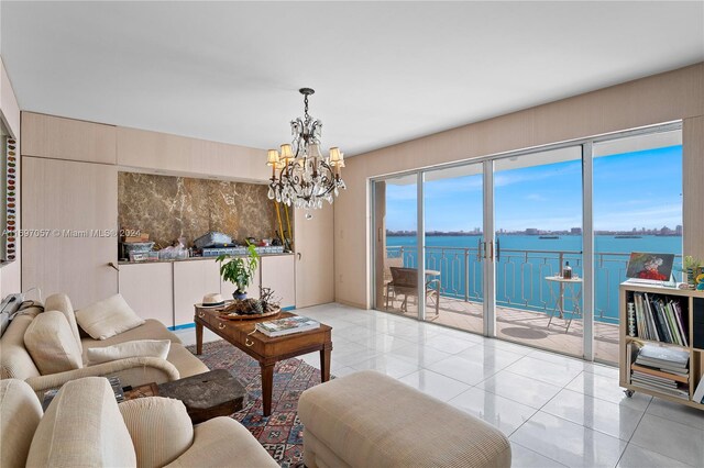 11111 Biscayne Blvd Unit 12F, Miami, FL 33181 - living room featuring a chandelier, tile patterned flooring, and a water view