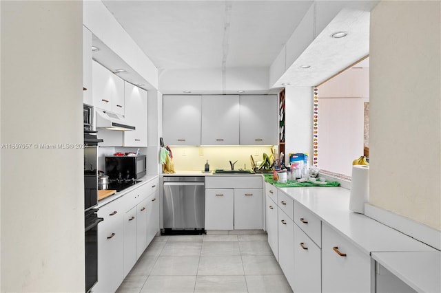 kitchen with light tile patterned flooring, sink, white cabinetry, and black appliances