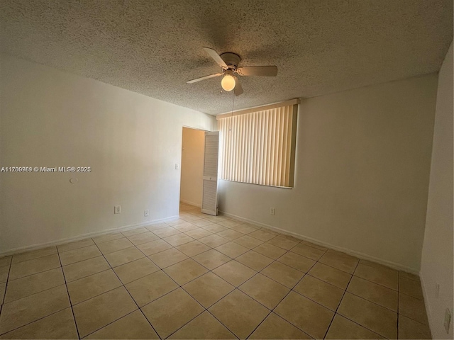 4015 W Mcnab Rd Unit D101, Pompano Beach, FL 33069 - tiled empty room featuring a ceiling fan and a textured ceiling