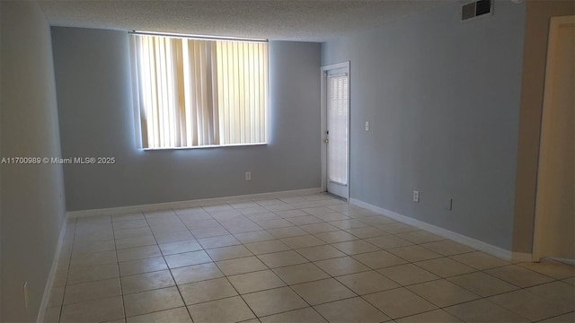 4015 W Mcnab Rd Unit D101, Pompano Beach, FL 33069 - unfurnished room featuring a textured ceiling and light tile patterned flooring