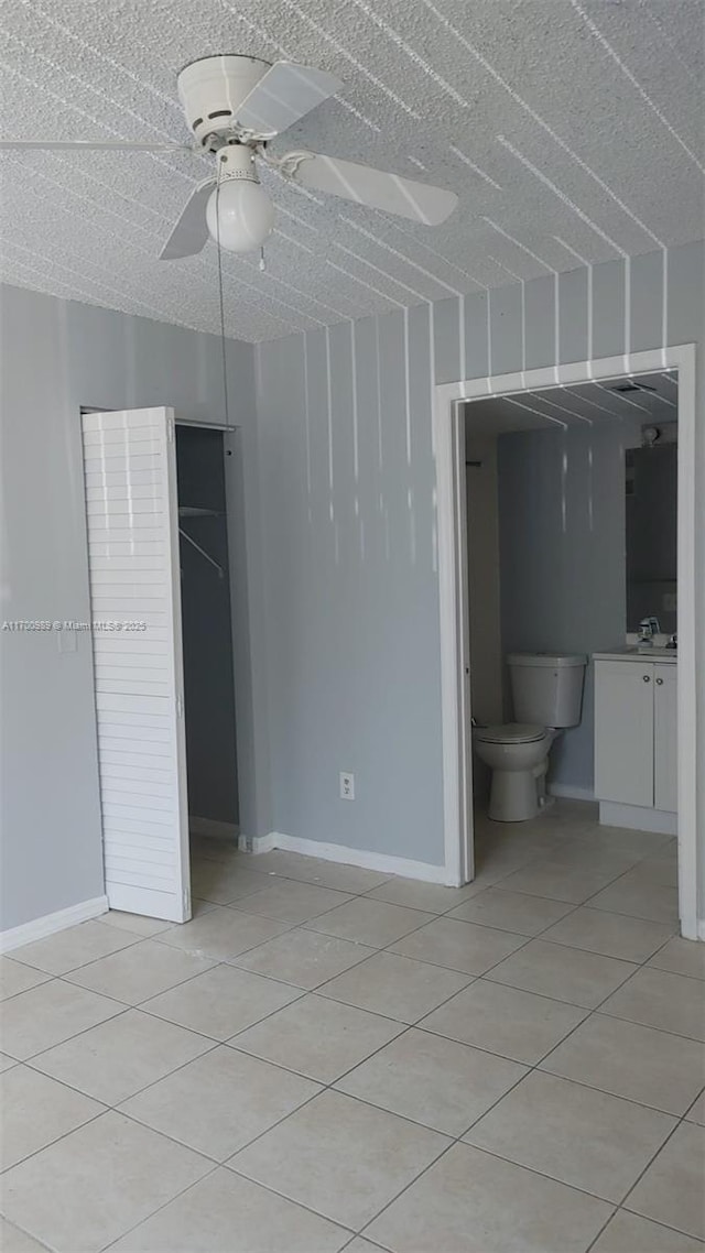 4015 W Mcnab Rd Unit D101, Pompano Beach, FL 33069 - unfurnished bedroom with light tile patterned floors and a ceiling fan