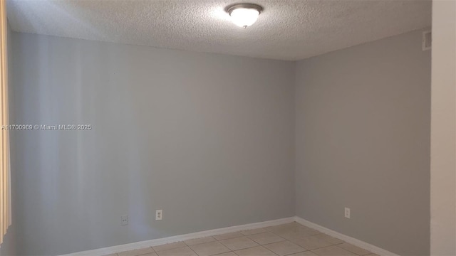 4015 W Mcnab Rd Unit D101, Pompano Beach, FL 33069 - unfurnished room featuring a textured ceiling and light tile patterned flooring