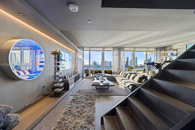 living room featuring concrete floors and expansive windows