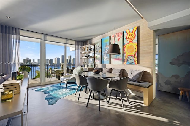 dining room featuring floor to ceiling windows