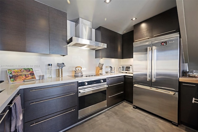 kitchen featuring wall chimney exhaust hood and appliances with stainless steel finishes