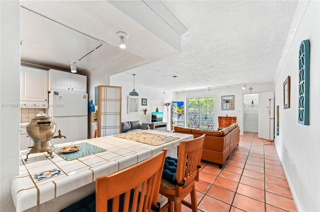 bathroom featuring toilet, tile patterned floors, and crown molding